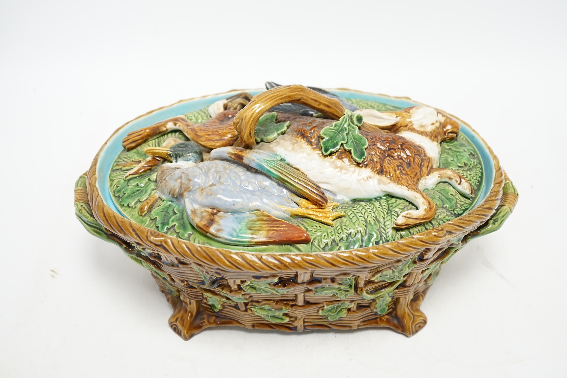 A Minton Majolica game pie dish and cover, 32cm long. Condition - good